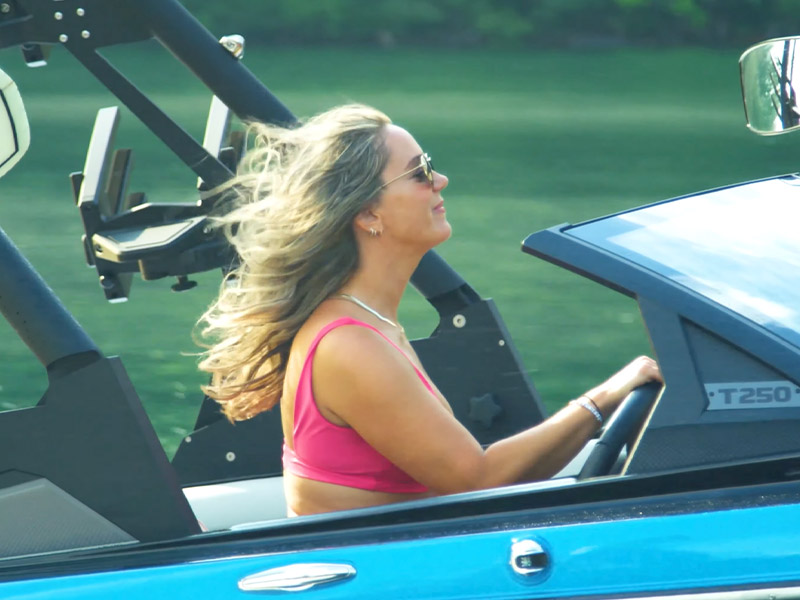 woman steering boat