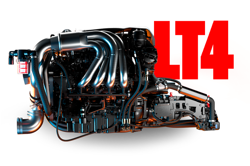 Studio close-up of the black Monsoon LT4 marine engine with polished chrome exhaust headers and warm rim lighting, on a white background.