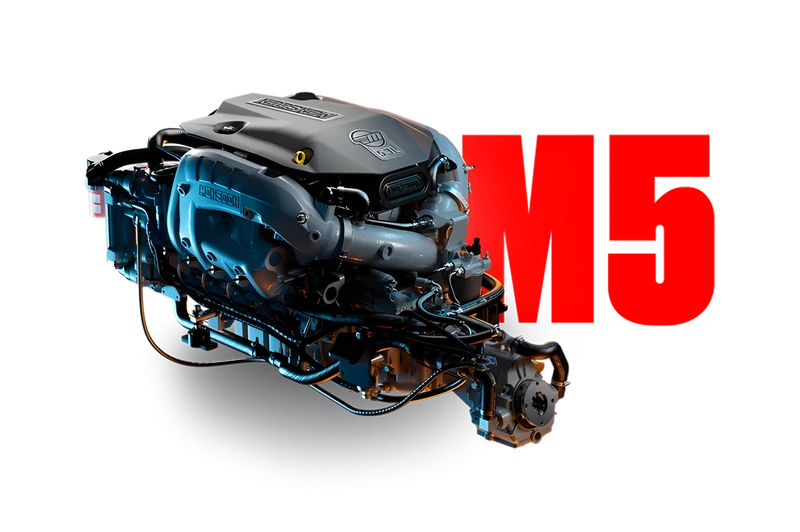 Studio shot of the Monsoon M5 marine engine with a gray Monsoon-badged cover and blue-and-orange lighting, beside a bold red 'M5' graphic on a white background.