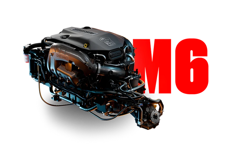 Studio shot of the darker Monsoon M6 marine engine with copper-and-blue lighting, beside a bold red 'M6' graphic on a white background.