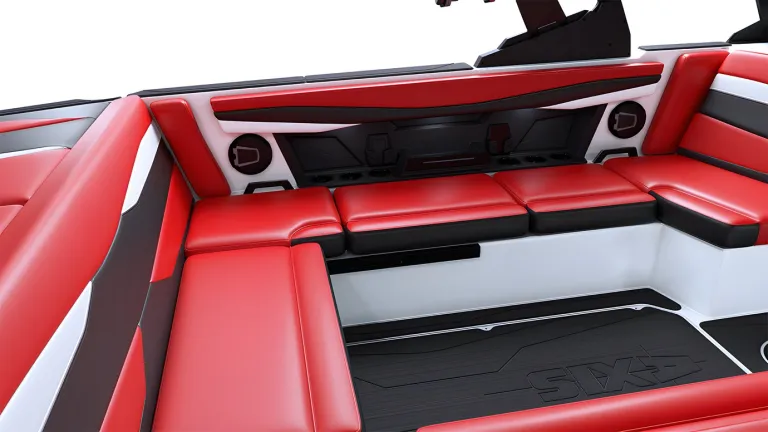 Overhead view of the red-and-black wraparound seating in an Axis A225 cockpit, with the Axis logo on the floor.