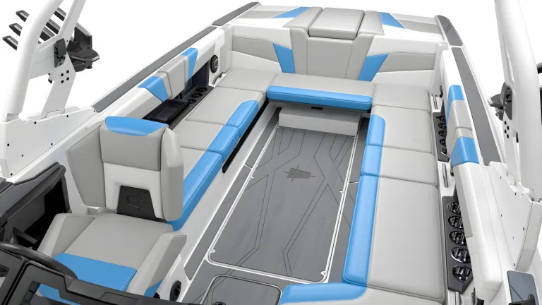 Studio render of the white, gray and blue cockpit of an Axis T250 seen from above, wraparound seating and helm on a white background.