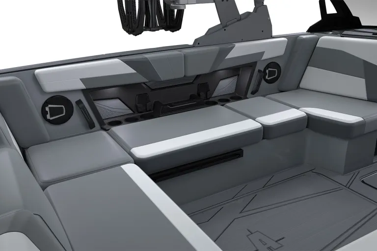 Close-up studio render of the Axis T220 dash caddy with a wireless phone-charging dock, cupholders and a Wet Sounds stereo below the ballast-control touchscreen, on a white background.