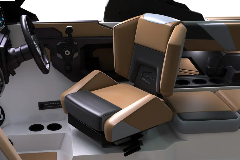 Studio render of the tan, gray and black captain's helm seat in an Axis T235, flip-up bolster beside the Axis-logo steering wheel and dash, on a white background.