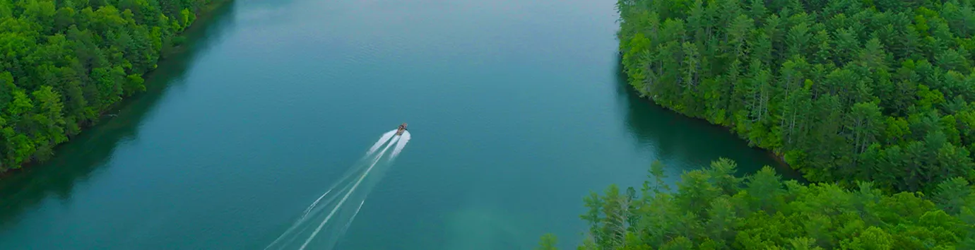 Boat running down the middle of the lake